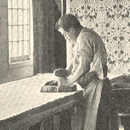 A fabric printer at Merton Abbey printing “Lodden” fabric, designed by Morris in 1884.
